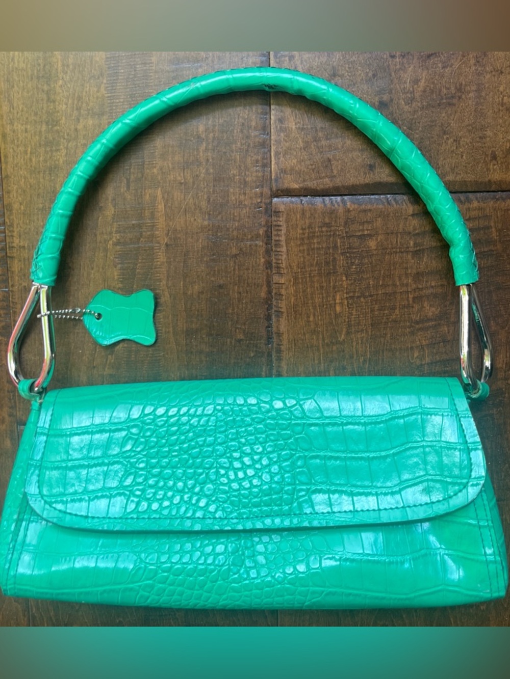 Green crocodile embossed leather handbag with silver hardware